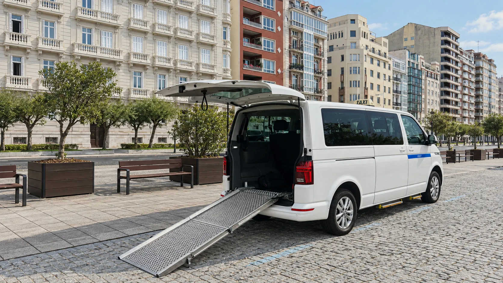 Adapted taxi with the rear ramp lowered on a Santander promenade