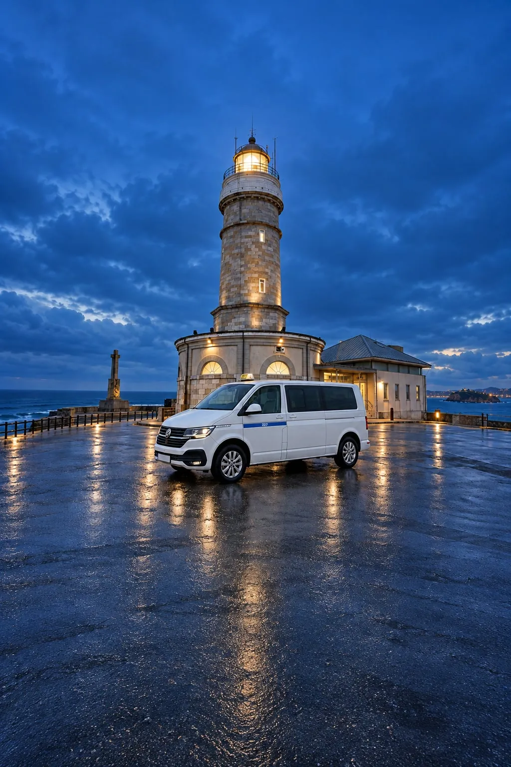 8-seater taxi in front of the Cabo Mayor lighthouse, in Santander, at dusk