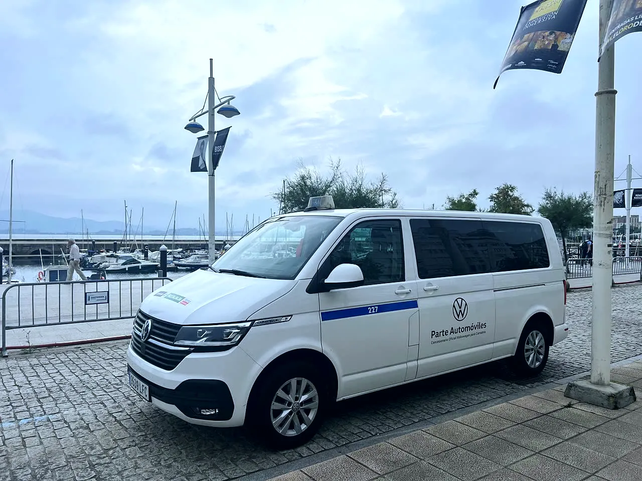 White 8-seater van next to the Puertochico marina, in Santander